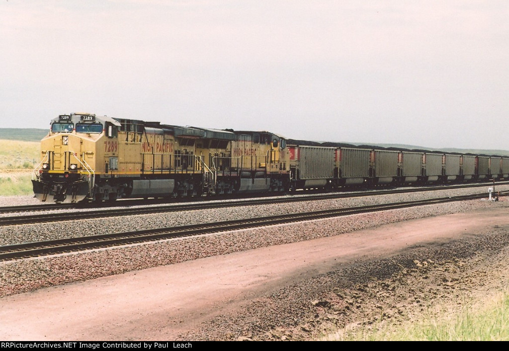 Loaded coal train rolls south